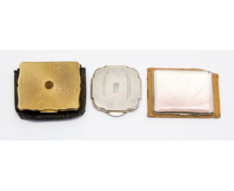 Three early to mid 20th Century compacts two silver and one turned enamel with one gilt&nbsp;