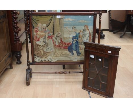 An early 20th Century mahogany framed tapestry firescreen; a mahogany small corner cupboard (2)