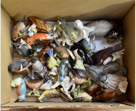A collection of Goebel and Beswick birds including; Robins, Blue Tit, Jay, Owl.&nbsp;Beswick; Goldfinch 2273, Goldcrest 2415,
