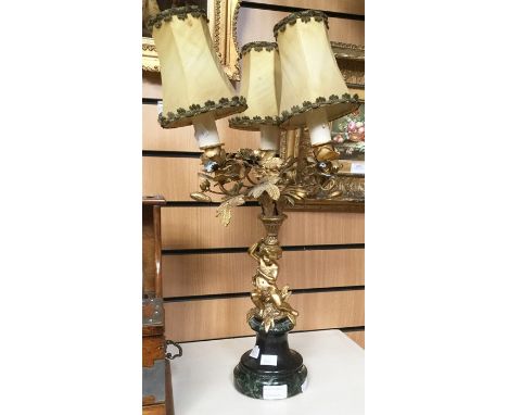 Gilt table lamp with putti on marble base