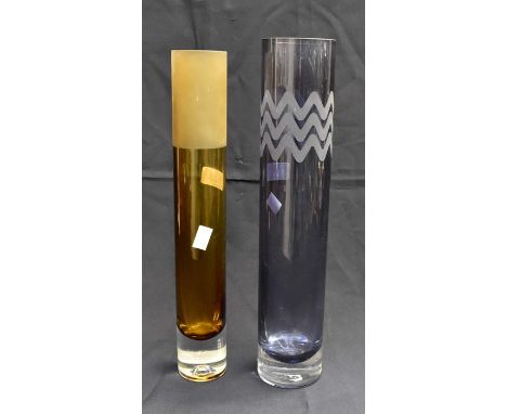 Two cylindrical art glass vases. The acid etched and brown vase signed to bottom, the midnight blue and etched vase- Svaga