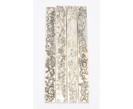 A set of four Chinese white metal scroll weights (4)