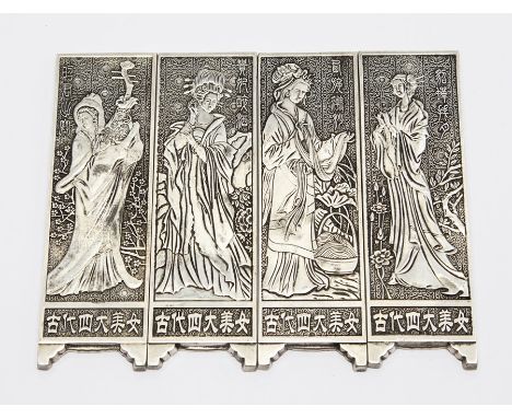 A set of four Chinese white metal scroll weights (4)