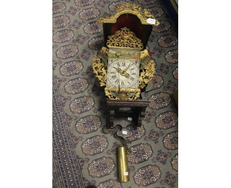 An early 19th Century Dutch Stoel clock, verge escapement with single weight, folk art decoration consisting of two stylised 