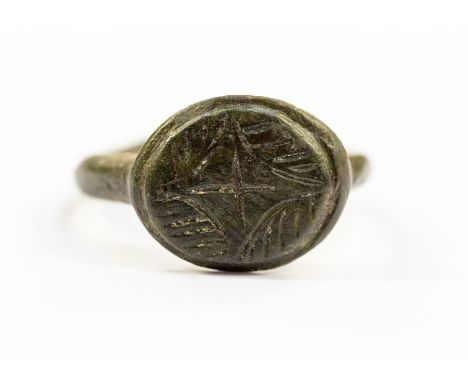 A medieval iron type Continental seal ring, basic intaglio seal of a cross v lines