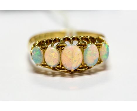 An Edwardian 18ct gold ring set with five graduated opals, size Q, approx 3.8gms, Chester 1909