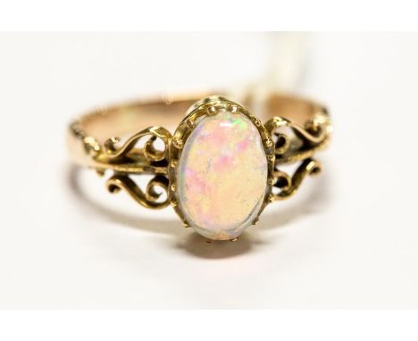 A 9ct gold ring set with a cabochon opal, size J1/2, approx 2.8gms