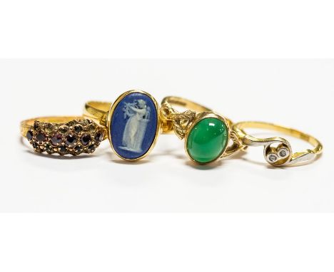 A collection of four gold rings, to include a 15ct gold and paste set ring circa 1859, a/f some stones missing and mount bent