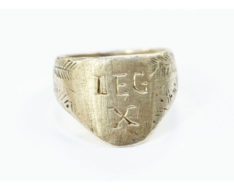 A large gentleman's white metal archers style ring, inscribed 'LEG X'