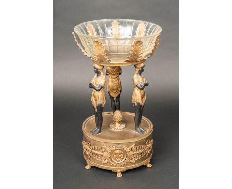 Classicistic Bronze Centrepiece, in egyptomanian style. Partly gilded and ebonized. Glass bowl cutted. 19Th Century. 41 cm hi