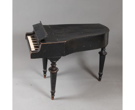 Children Piano, three octaves. Wooden mantle with curved and canted feet. Provenance Made by a piano maker in Krems at the Da