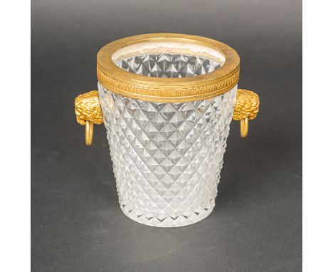 Classicistic Glass Bowl, with cutted geometrical ornaments. Gilded bronze border and lion heads. 19Th Century. 15 cm high.