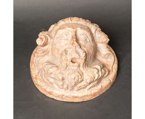 Salzburg Fountain Mask, red stone with inclusions. Masterly sculpted. Central hole. Probably Salzburg 16th Century. Diameter 