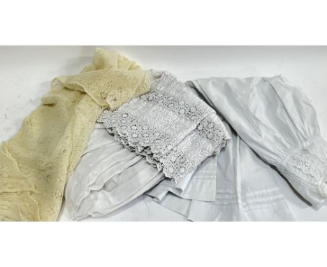 A group of vintage or antique clothing comprising a white wedding under slip, a Christening gown, and a wedding veil (3)