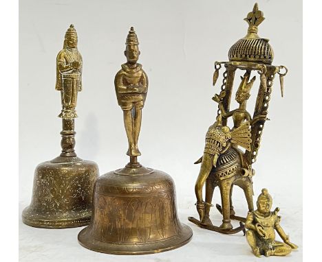 A group of vintage or antique Indian brass comprising two bells variously decorated with chased/engraved motifs and with figu