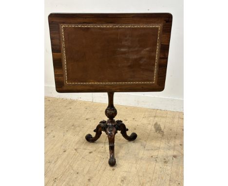 A Victorian rosewood side table, the rectangular top with inset brown gilt tooled skivver on turned carved baluster column an