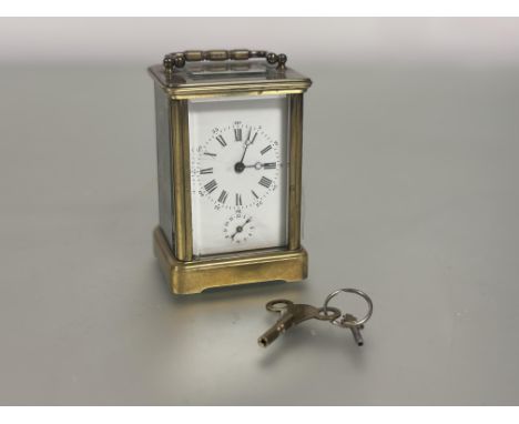 An Edwardain brass four glass alarm clock with white enamel dail and raoman and arabic numerals with subsiduaries dail alarm 