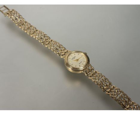 A Rotary lady's 9ct gold quartz wristwatch with gilt dial and baton hour markers on celtic knot style fixed bracelet D x 1.5c