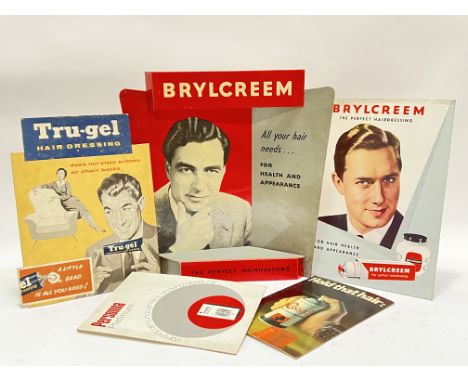 Vintage advertising,&nbsp;a mixed group of barber shop displays and point of sale advertising comprising two Brylcreem exampl