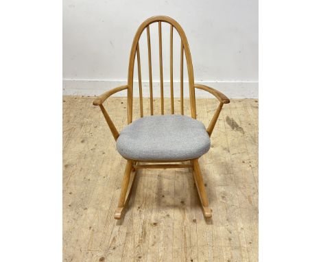 A 1960s Ercol light ash framed spar back rocking chair with elm saddle seat with associated seat pad H x 84 L x 60cm W x 41cm