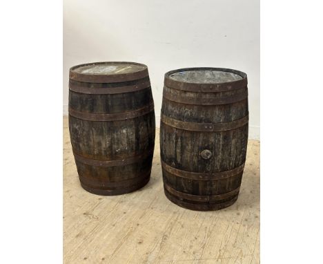 A vintage pair of weathered oak coopered bound whiskey barrels H 87cm D x 54cm&nbsp;
