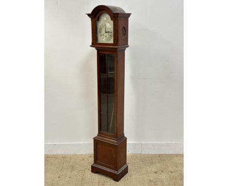 A 1920s mahogany Westminster chime grandmother clock with arched top and silver dial, with roman numerals, with glazed panel 