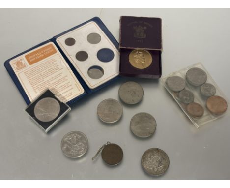 A collection of coins to include a set of first decimal coins in original blue vinyl wallet, seven various crowns including a