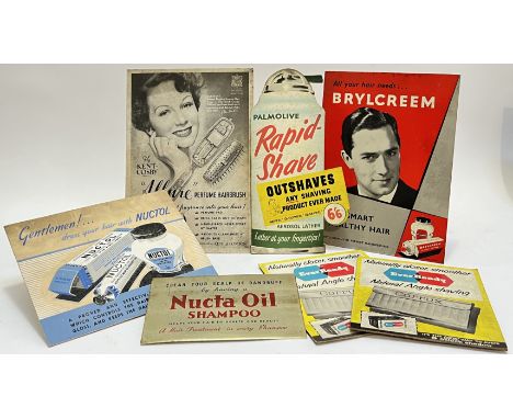 A mixed group of vintage Barber shop advertising signs,&nbsp;comprising six easel back cardboard point of sale signs (Brylcre