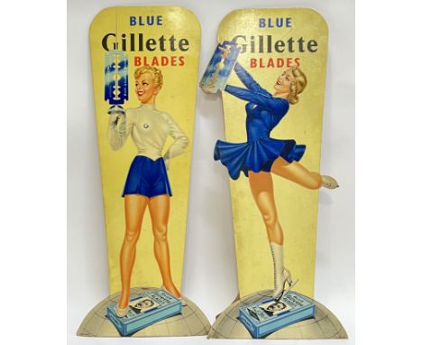 Two vintage Gillette Barber Shop advertising signs,&nbsp;each advertising blue blades, with female skater/fencer (cardboard e