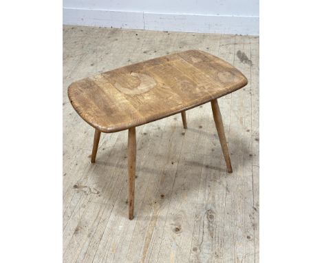 A 1960s Ercol elm topped occasional table of rectangular form with rounded angles on light ash splay tapered supports signs o