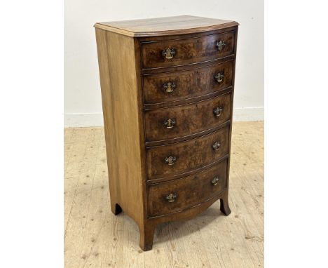 A 1920s bow front burr walnut crossbanded tallboy chest of five graduated long drawers, with brass handles and shaped apron, 