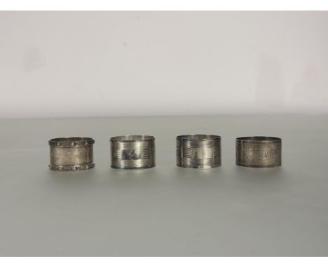 A pair of Birmingham silver napnin rings with engine turned horizontal linear design Birmingham 1944 H x 3cm, a Birmingham si