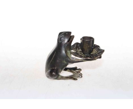 Patinated bronze frog-form candle holder