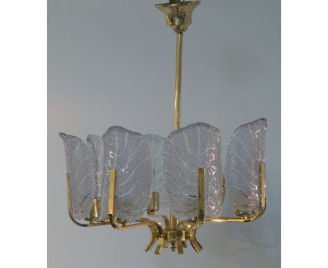 Carl Fagerlund (1915-2011) for Orrefors, an eight light chandelier, circa 1960, the brass frame with six acanthus form glass 