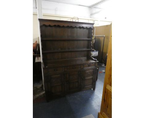 An Edwardian Oak Dresser, The Base with Three Drawers Over Cupboard with Carved Panel Doors, Two Shelf Plate Rack Over, 187cm