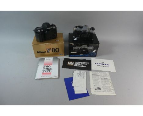 A Nikon 80 35mm Camera Together with an Olympus OM 10 Both in Original Boxes