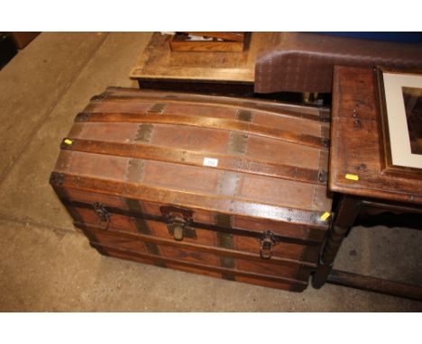 A wooden and metal bound dome topped trunk 