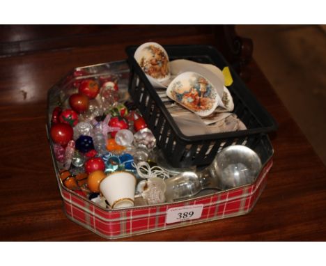 A tin containing Art Glass sweets, decanter stopper etc.