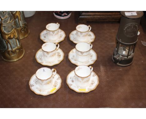 Six each Royal Crown Derby "Royal St James's" coffee cups and saucers