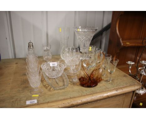 A quantity of various cut glassware to include a trumpet shaped vase, drinking glasses, sugar sifter etc.