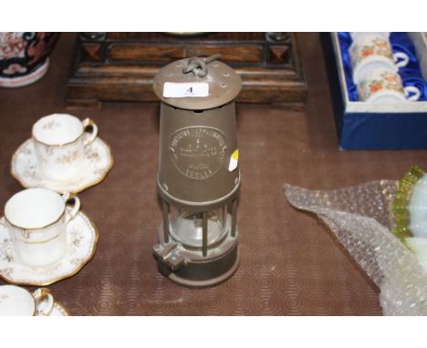 A Projector Lamp and Lighting Co. brass cased miners lamp