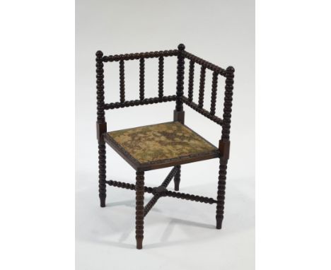 A late Victorian mahogany bobbin turned corner chair 