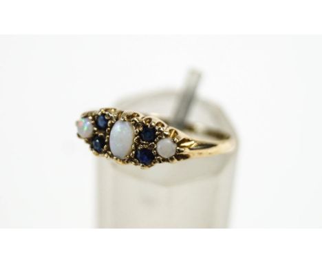 A 9 carat gold opal and sapphire dress ring, finger size O, 1.5 g gross