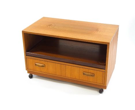 A G-Plan Fresco teak television stand, with pull out shelf and drawer, 82cm wide x 46cm deep x 53cm high