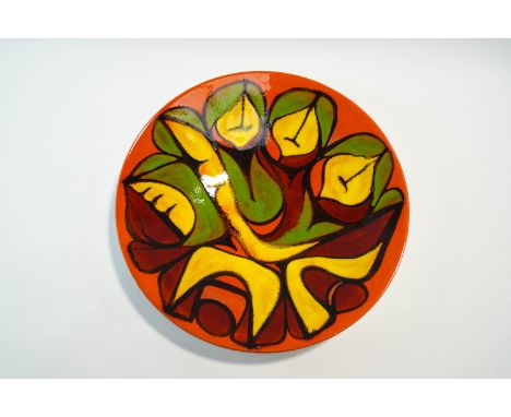A  Poole Pottery 'Delphis'  shape 54 charger, designed by Cynthia Bennett, 41cm diameter