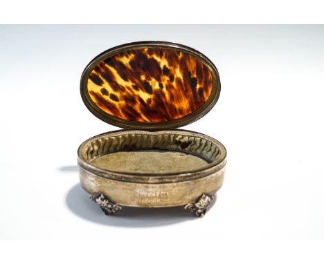 A silver and tortoise shell oval trinket box, by Mappin & Webb, Birmingham 1920, on four bracket supports, inscribed, 12.8 cm