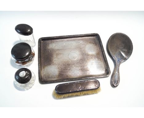 A silver dressing table tray, by Mappin & Webb, London 1911, with linear engine turned decoration, 27.5 cm long, with a match