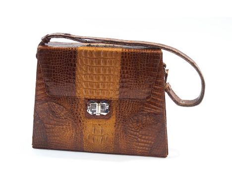 A vintage crocodile skin handbag with a swing handle