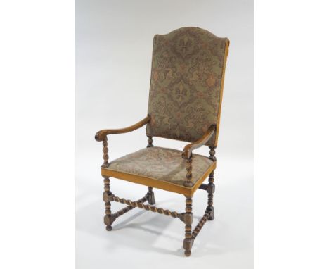 A 19th Century open armchair with barley twist supports and wool tapestry style upholstery