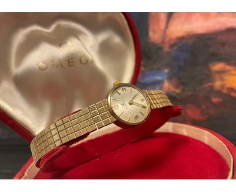 Omega - a 1960s 9ct gold lady's cocktail wristwatch, silver dial, quartered Arabic numerals and block baton markers, 483 cal 